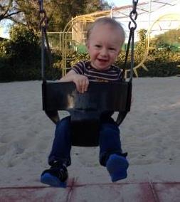 Infant in Swing - Playground - Caucasian - Male - Nathaniel Miller - Crop